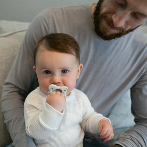 Dr. Browns Natural Flow Anti-Colic Options  Deluxe Bottle Essentials Gift Set with 100% Silicone HappyPaci Pacifier, Bottle Brush and Dishwasher Basket for Bottle Parts, BPA Free, 0m