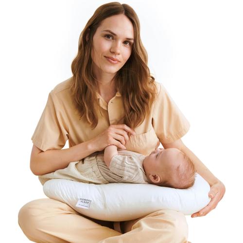 Nursing pillow with a 100% cotton satin cover. Firm maternity pillow for breastfeeding and support. Multi-purpose comfort during pregnancy and postpartum. Boomerang design by Nordic Sleep.