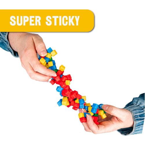 KOMARC GAMES StickiKubes, Mini Stacking Cubes That Stick to Anything, Non Toxic Kid Safe Sticky Blocks, Creative Construction Toy - 36 Cubes, 4 Colors, Display Easel