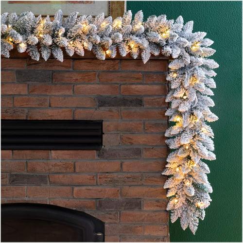 Glitzhome 9ft Christmas Garland for Mantle, Pre-Lit Snow Flocked Christmas Garland with Warm White LED Lights and Timer for Fireplace, Dining Table, Stairs Christmas Decoration