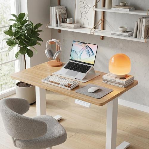 HUANUO 32x19 Inch Small Electric Standing Desk, Adjustable, Light Walnut | 176 Lbs Capacity, Rounded Corners, Wheel-Ready Feet, Compact Desktop, Apartment Workspace, 28.3–46.5 Inch Height Range