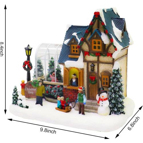 MOMENTS IN TIME Christmas Village Building Lighted Christmas Shop with LED Lights, Music & Snowman Battery Operated or Plug-in Vintage Holiday Village House Décor 8.5”H x 9.8”W x 6.9”D