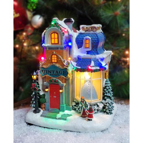 MOMENTS IN TIME Lighted Christmas Village Vintage Boutique LED 10.6” Musical Polyresin Holiday Building, Battery Operated Tabletop Christmas Decoration