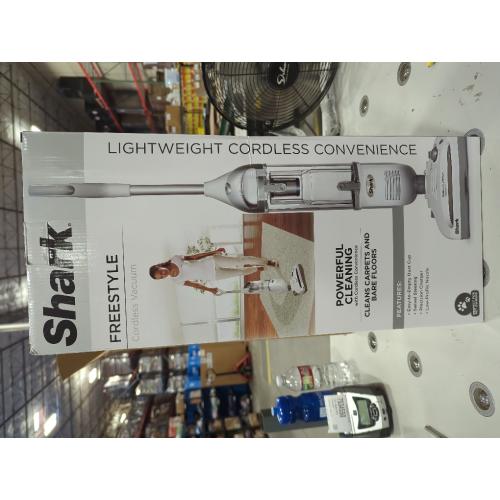 White and Silver Shark Navigator Freestyle Bagless Cordless Washable Filter Upright Vacuum for Hard Floors and Rugs with XL Dust Cup in White