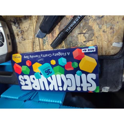 KOMARC GAMES StickiKubes, Mini Stacking Cubes That Stick to Anything, Non Toxic Kid Safe Sticky Blocks, Creative Construction Toy - 36 Cubes, 4 Colors, Display Easel