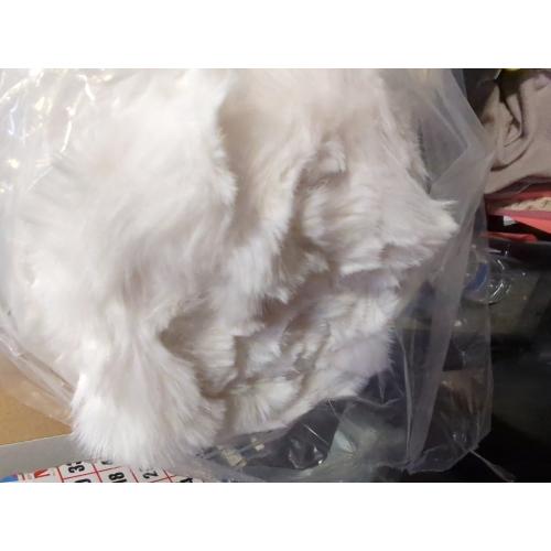 Soft white blanket for beds and sofas, perfect for snuggling.