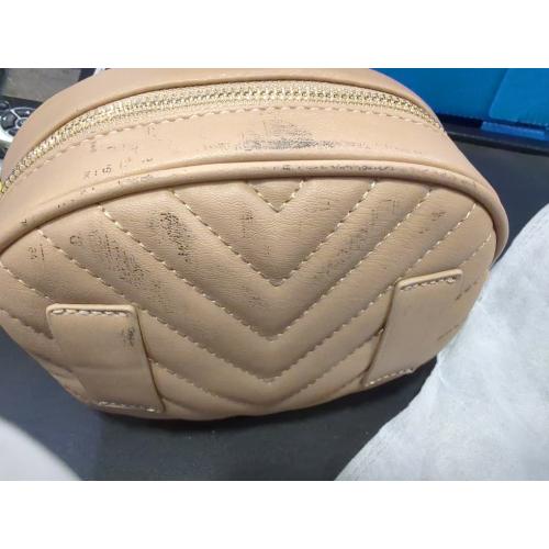 Color cream handbag and has an accessory to put on the waist