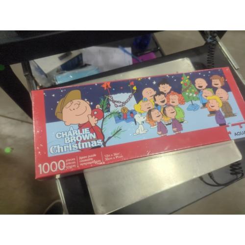 AQUARIUS Peanuts Charlie Brown Christmas Puzzle (Slim 1000 Piece Jigsaw Puzzle) - A Charlie Brown Christmas Puzzle - Officially Licensed - Glare Free - Precision Fit - 12 x 36 Inches, Multi Color