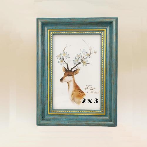 2x3 Blue Picture Frame.Table and Wall.Transparent Acrylic Panel