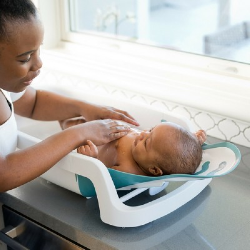 The First Years Sure Comfort 4-in-1 Reclining Newborn to Toddler Baby Bathtub - White